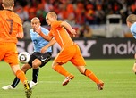 Uruguay v Netherlands: 2010 FIFA World Cup - Semi Final  Wesley Sneijder of the Netherlands and Egidio Arevalo Rios of Uruguay compete for the ball during the 2010 FIFA World Cup South Africa Semi Final match between Uruguay and the Netherlands at Green Point Stadium on July 6, 2010 in Cape Town, South Africa. (Photo by Doug Pensinger/Getty Images for Sony)  Doug Pensinger  2010 Getty Images